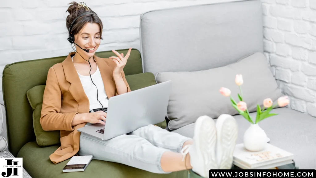 a woman sitting on a couch with a laptop and headphones